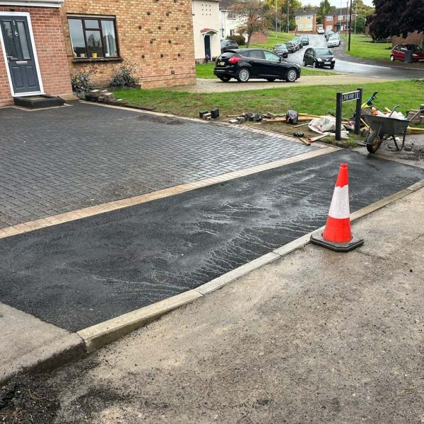 Permeable block paved drive and drop kerb